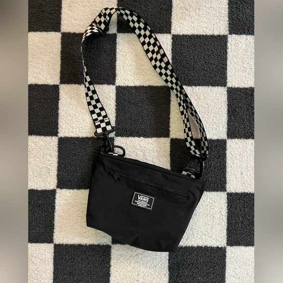 Vans Handbags - Vans black cross body bag with checkered adjustable strap.